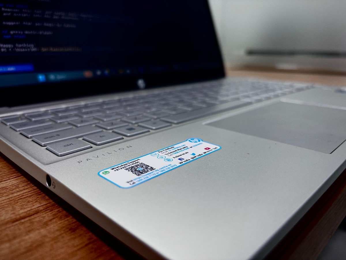 Hands typing on a laptop keyboard